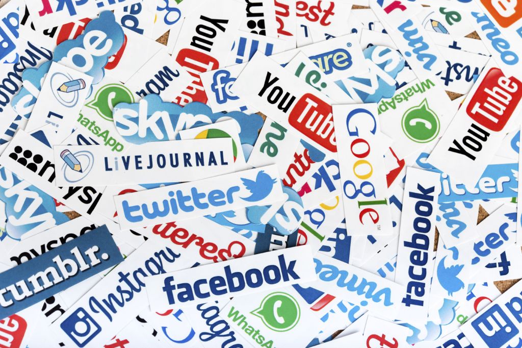 BELGRADE - JUNE 13, 2014 Social media website logos Facebook, Twitter and other printed on paper