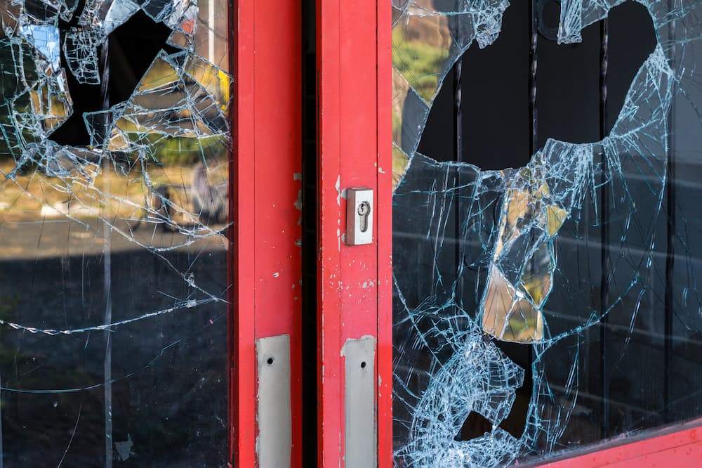 vandalised windows broken in door